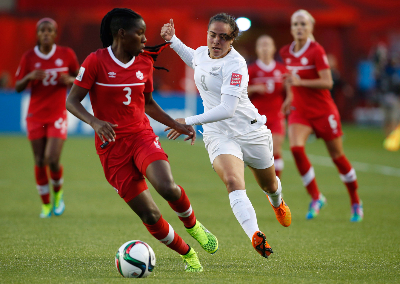 Canada's Kadeisha Buchanan (left) is chased by Jasmine Pereira of New Zealand at the FIFA Women's World Cup on June 11, 2015. 