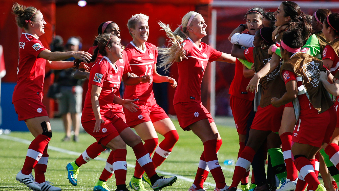 Canadian players celebrate on the touchline after Christine Sinclair's goal on June 6, 2015.