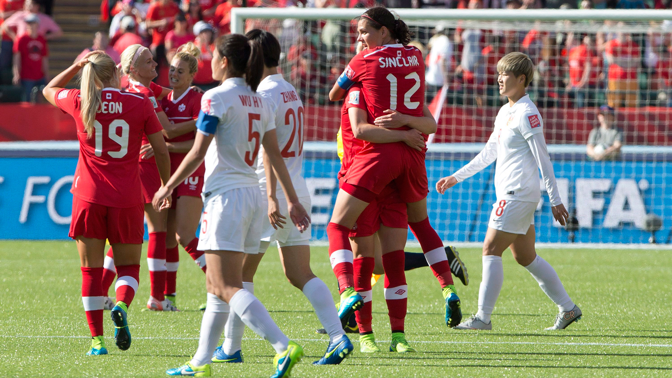 Canadian players celebrate beating China at the opener of the 2015 FIFA Women's World Cup on June 6, 2015.
