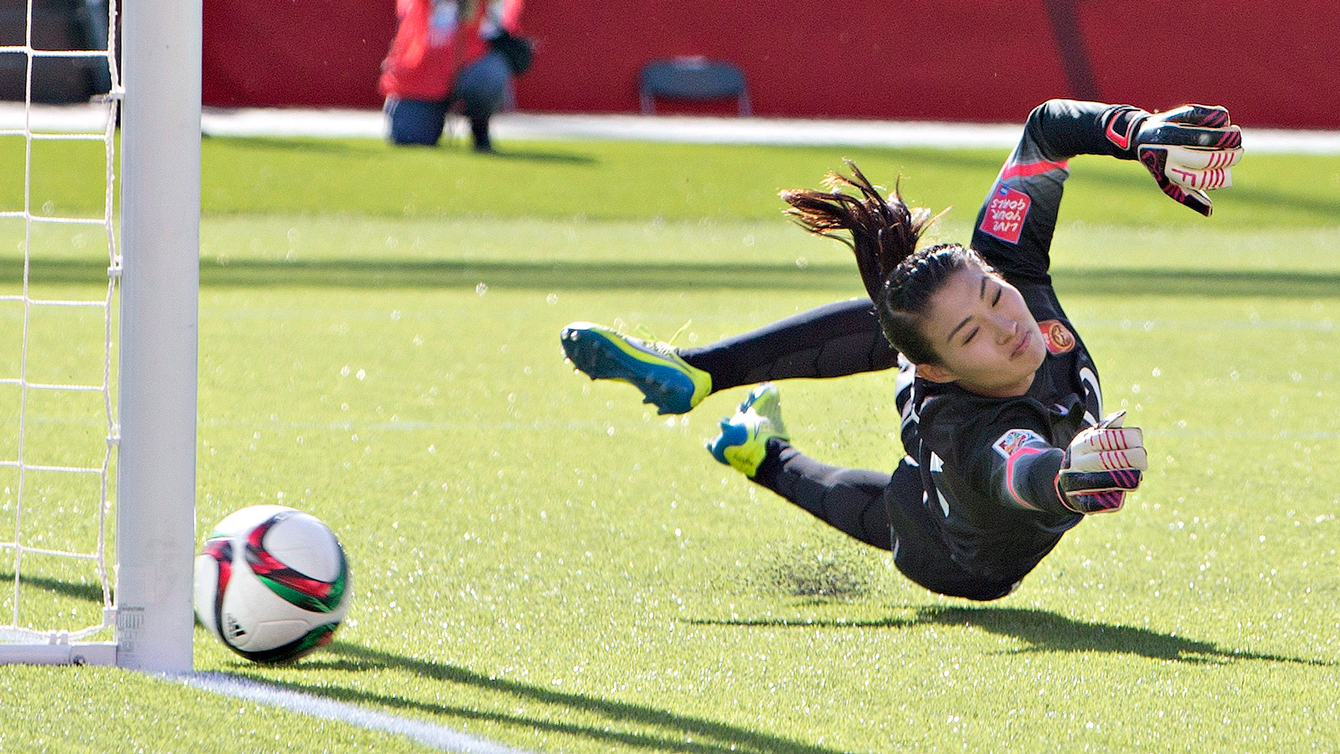 China's Wang Fei unable to stop a Christine Sinclair penalty in FIFA Women's World Cup on June 6, 2015.