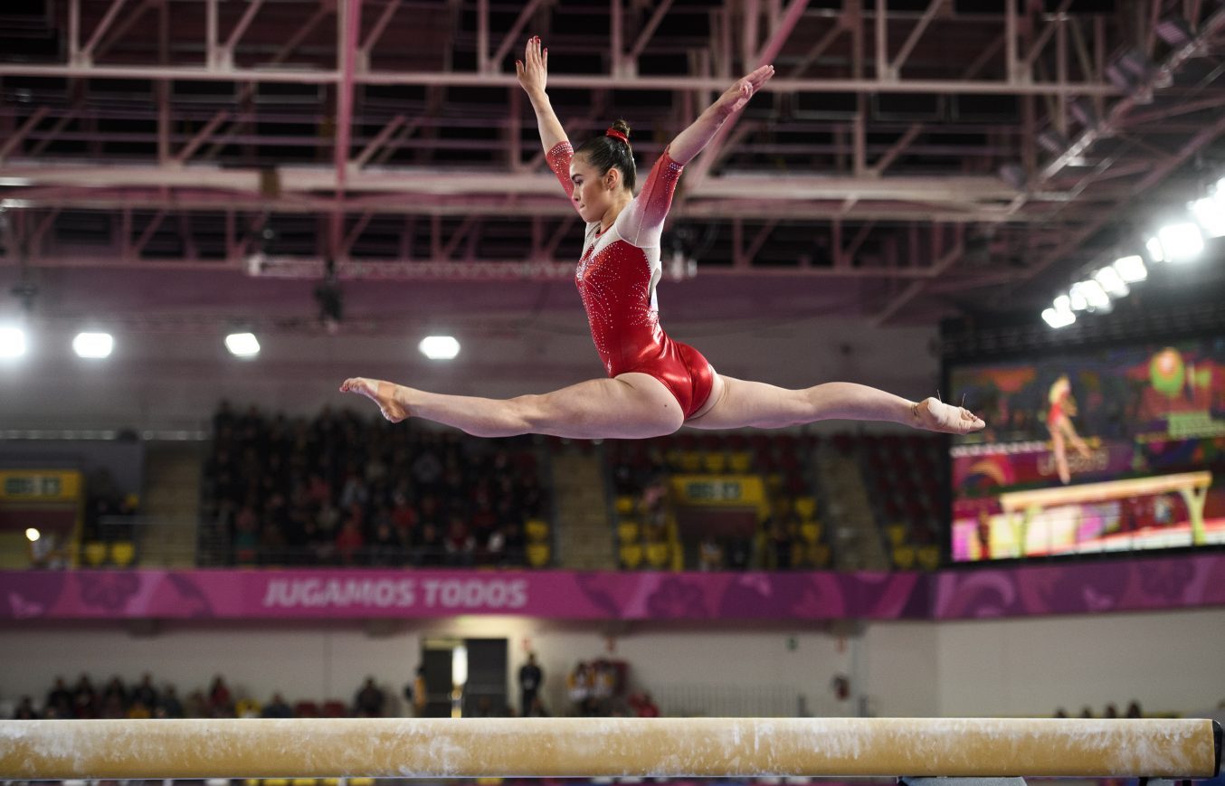 What are the differences between artistic gymnastics and rhythmic