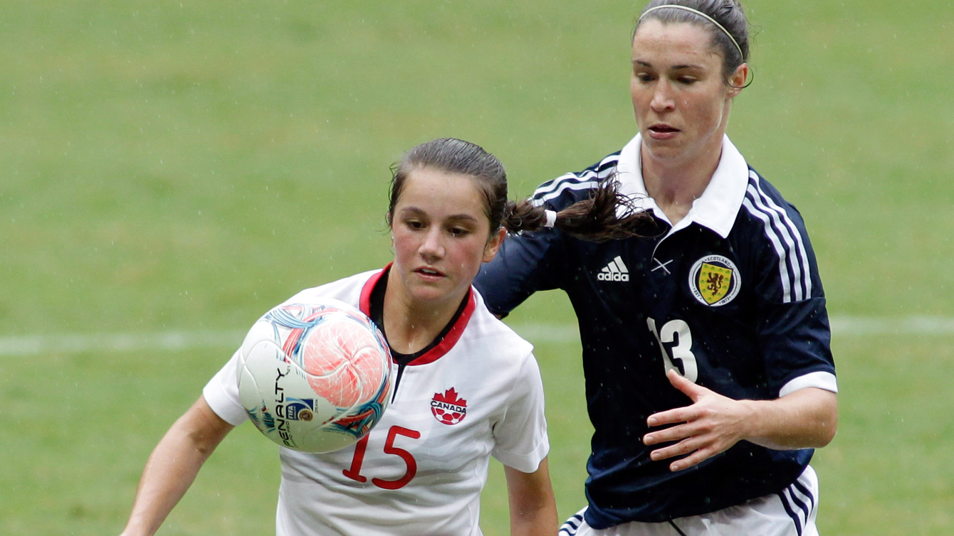 Jessie Fleming, the same year she made her senior team debut at age 15, fights for a ball at a tournament in Brazil on December 22, 2013.