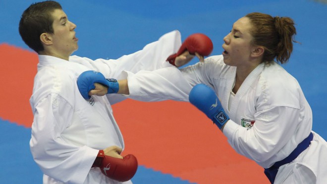 Olivia Grant (left) of Toronto faces Xunashi Caballero of Mexico in karate semi-finals at the 2011 Pan American Games in Guadalajara.