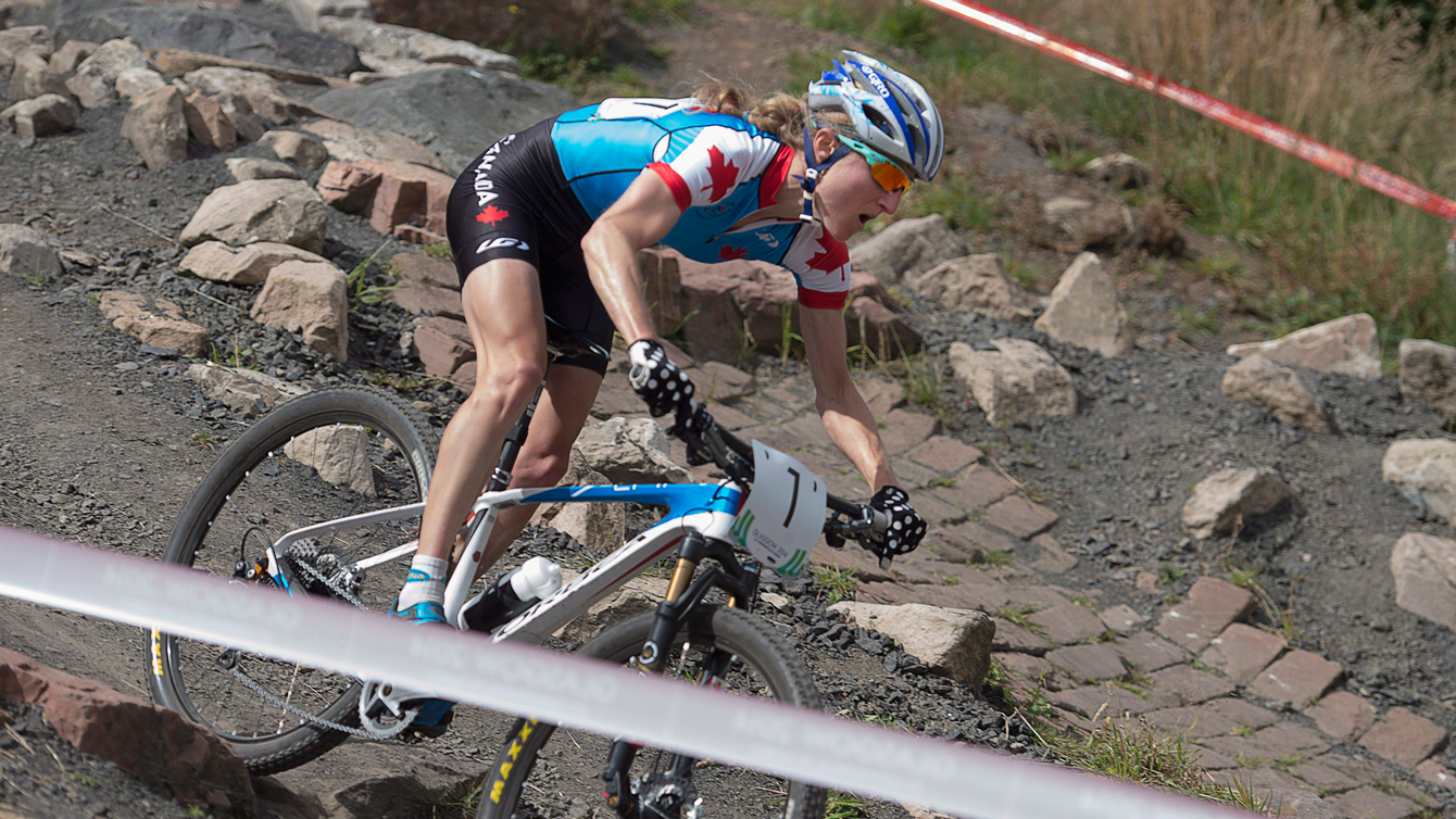 Catharine Pendrel races to gold in the women's cross-country event at Cathkin Braes mountain bike trails at the Commonwealth Games in Glasgow, Scotland, July 29, 2014. 