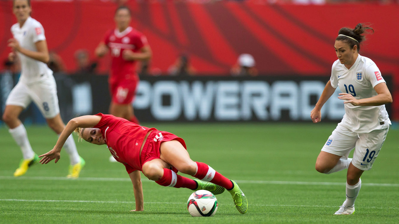 Lauren Sesselman slips and Jodie Taylor takes advantage to give England a 1-0 lead over Canada at the FIFA Women's World Cup quarterfinals on June 27, 2015. 
