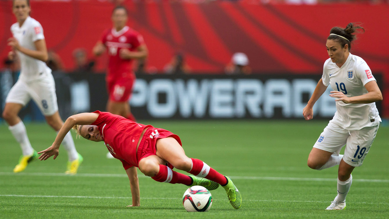 Lauren Sesselman slips and Jodie Taylor takes advantage to give England a 1-0 lead over Canada at the FIFA Women's World Cup quarterfinals on June 27, 2015.