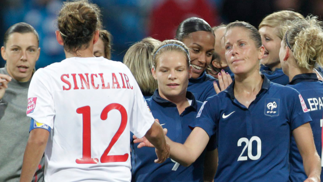 Canada's Christine Sinclair shakes hands with French players after a 4-0 loss to France at the FIFA 2011 Women's World Cup.