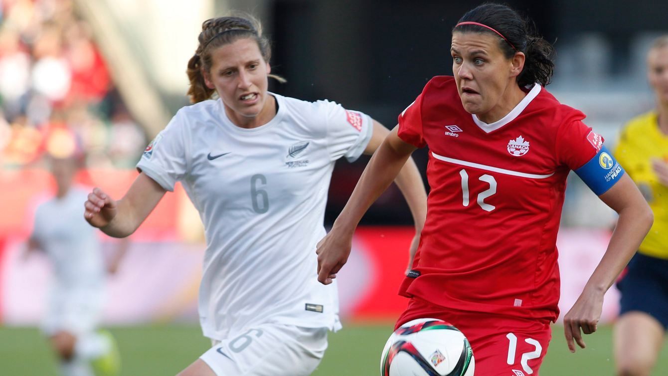 Christine Sinclair is watched by Rebekah Stott during the FIFA Women's World Cup on June 11, 2015. 