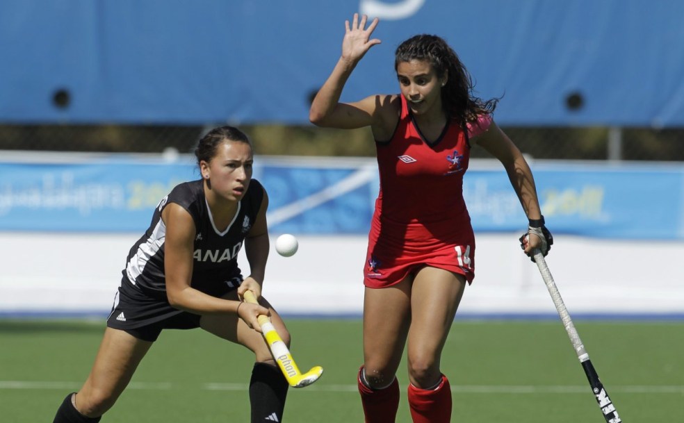 Canada's Sara Mcmanus, left, plays the ball