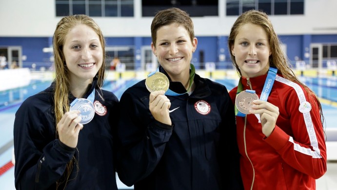 Caitlin Leverenz, Meghan Small, Sydney Pickrem, Gold medalist Caitlin Leverenz, center, of the United States, poses with silver medalist Meghan Small, left, of the United States, and bronze medalist, Sydney Pickrem, right, of Canada, after the women's 200 meter individual medley swimming event at the Pan Am Games Sunday, July 19, 2015, in Toronto. Photo by AP Photo/Mark Humphrey