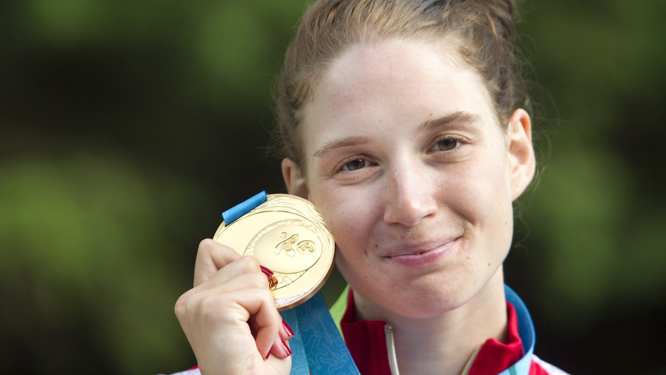 Canada's Jazmyne Denhollander with her gold medal after winning the Women's Kayak (K1) final at the Minden White Water Preserve.