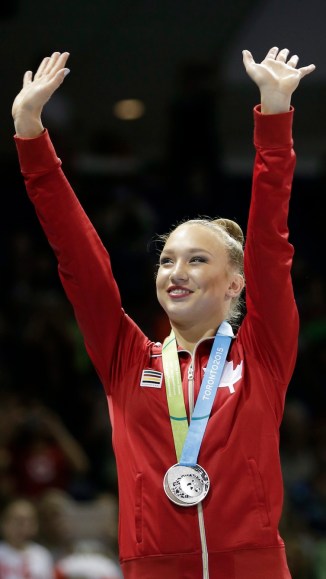 Patricia Bezzoubenko waves after winning the silver medal