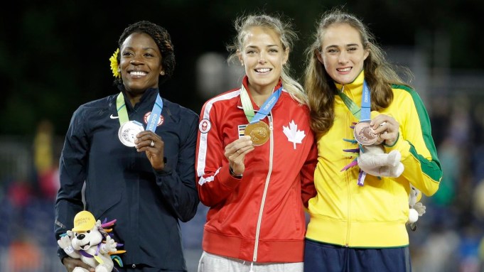 Women's 800 meter gold medal winner Melissa Bishop, center, of Canada, poses with the other medallists