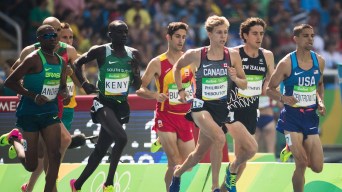 A group of male runners on a track