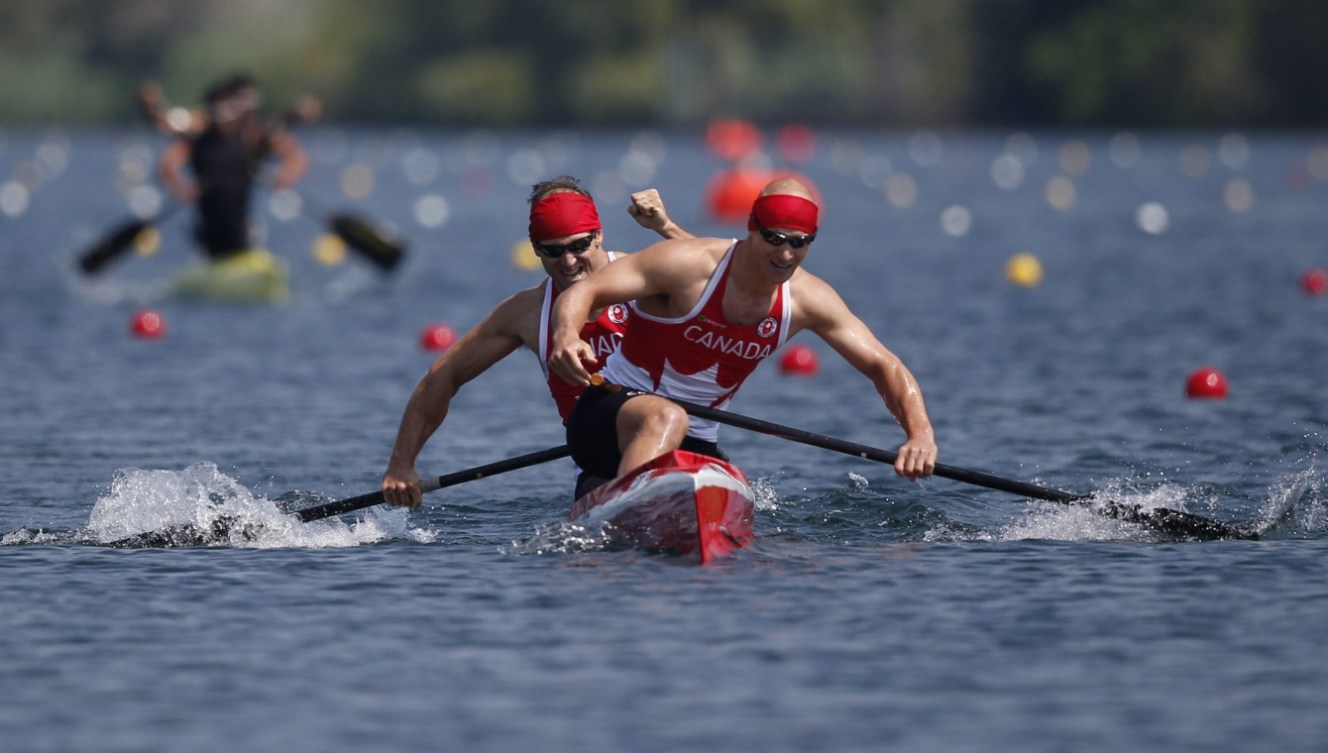 Canada's Benjamin Russell and Gabriel Beauchesne-Sevigny celebrate Gold in the C2 1000M race at the Pan Am Games in Toronto Monday, July 13, 2015.  COC Photo by Michael P. Hall
