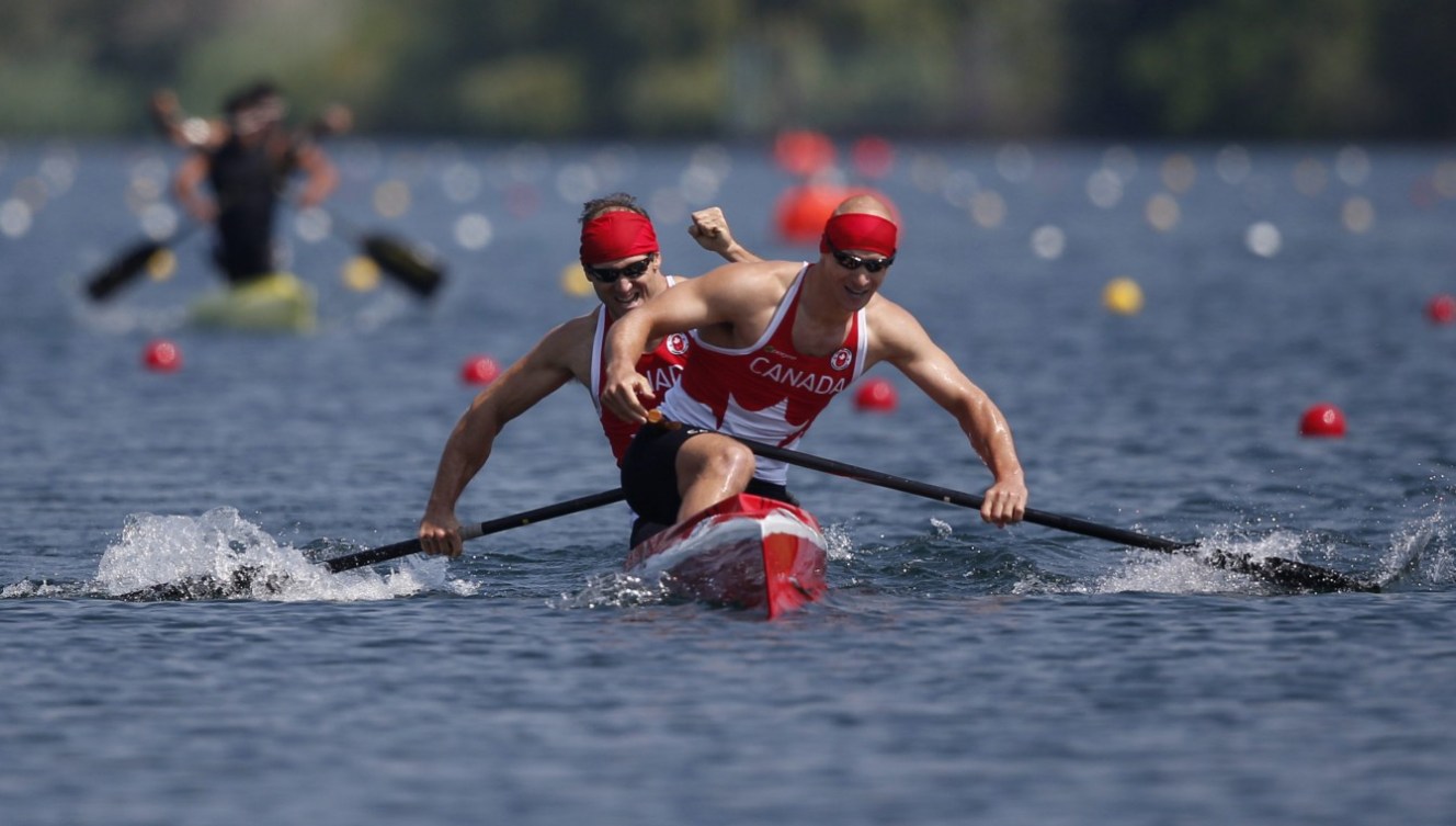 Canada's Benjamin Russell and Gabriel Beauchesne-Sevigny celebrate Gold in the C2 1000M race at the Pan Am Games in Toronto Monday, July 13, 2015. COC Photo by Michael P. Hall