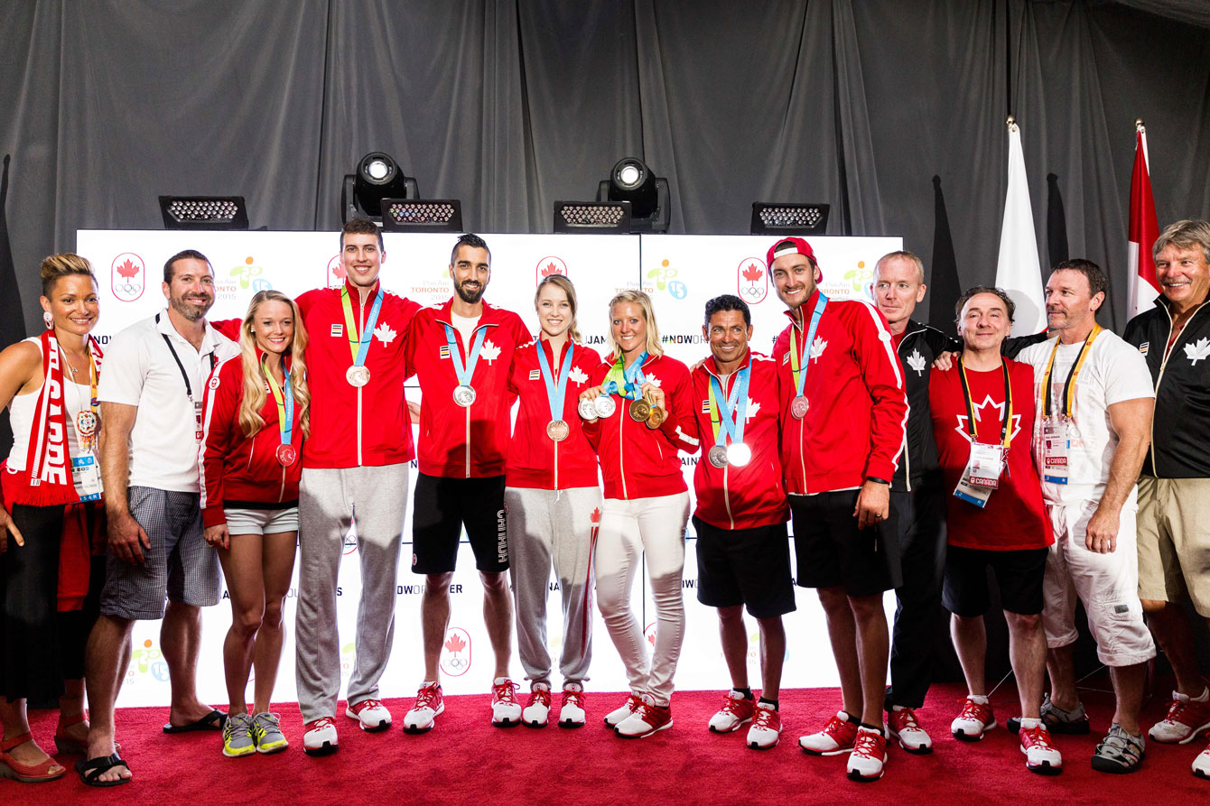 Horn-Miller (far left) celebrates with athletes at a Canada House medal celebration.