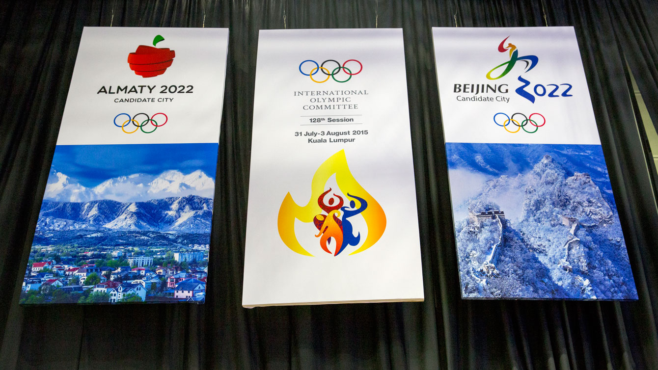 The 2022 Olympic Winter Games bid posters for Almaty and Beijing hang in Kuala Lumpur, Malaysia where the winner - Beijing - was decided by IOC in a 44-40 vote in favour of the Chinese capital.