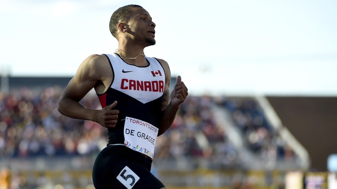 Andre De Grasse competes in the men's 100m.
