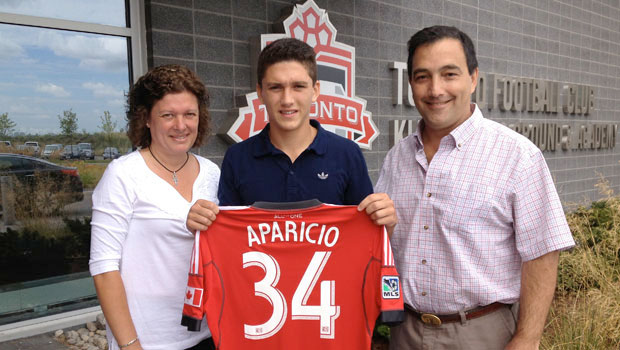 Manuel (Manny) Aparicio with his parents after signing his first pro contract with Toronto FC on August 13, 2013 (Photo: Asif Hossain/TorontoFC)