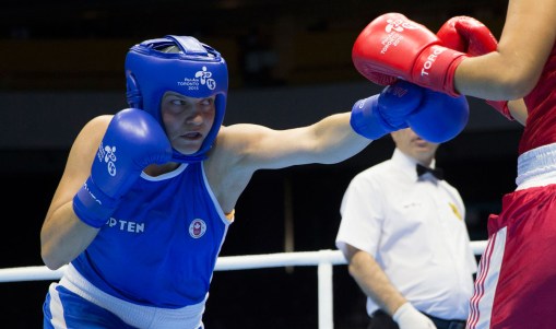 anadian Ariane Fortin, left, punches Yenebier Guillen Benitez, of the Dominican Republic, in round two the women's middle (69-75kg) semi-final bout during 2015 Pan Am Games boxing action in Oshawa, Ontario on Tuesday, July 21, 2015.