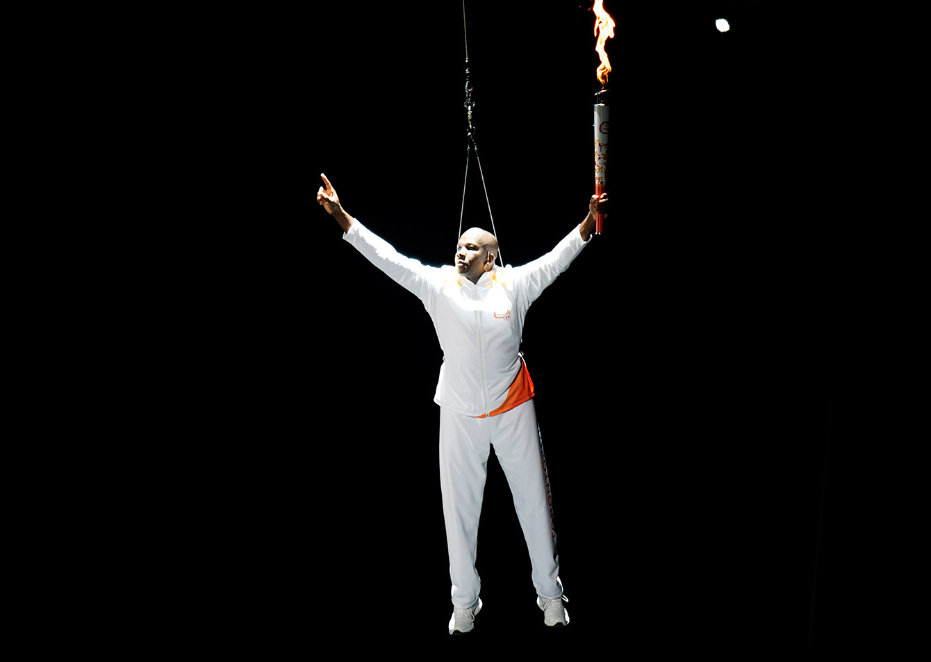 Donovan Bailey brings the Pan Am flame into the Opening Ceremony of the Toronto 2015 Pan American Games.