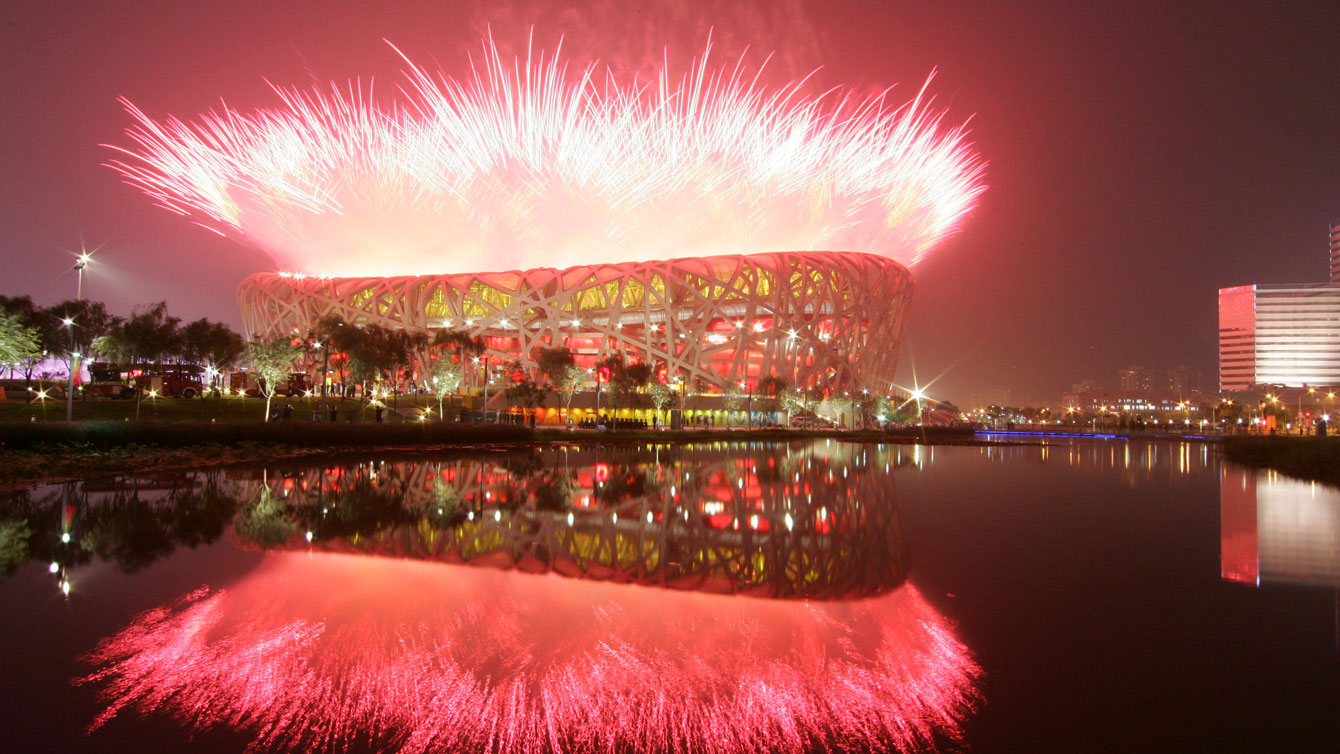 The National Stadium or "Bird's Nest" in Beijing, as fireworks explode during the Opening Ceremony of the 2008 Olympic Games. 