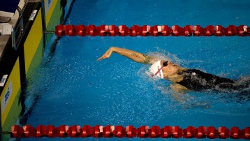 Canada's Hilary Caldwell reaches for the wall to win the women's 200m backstroke.
