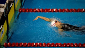 Hilary Caldwell Canada's Hilary Caldwell reaches for the wall to win the women's 200m backstroke.