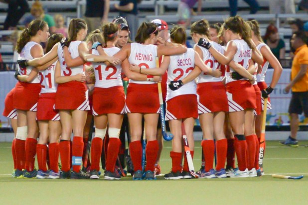 Team Canada's women's field hockey team in a huddle
