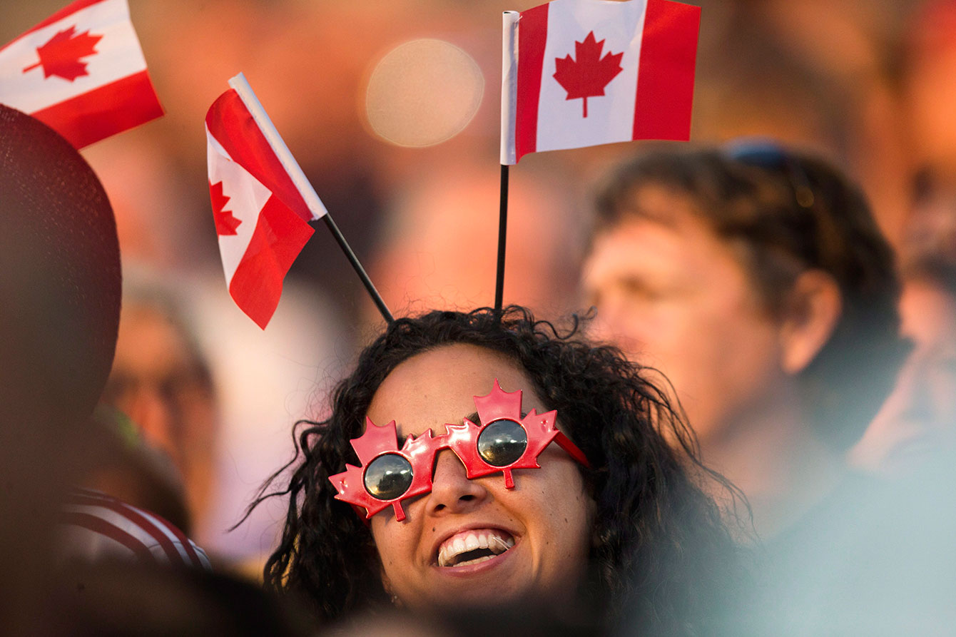 A maple leaf-wearing fan in the crowd at Canada-Panama Pan Am Games football match on July 16, 2015.
