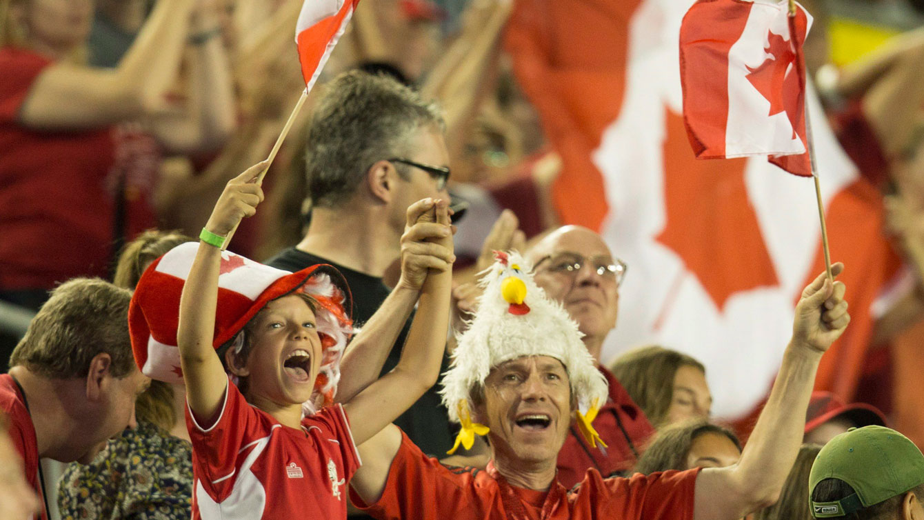 Fans in Hamilton celebrate as Canada routs Ecuador 5-2 in the women's football opener of the Pan Am Games on July 11, 2015.