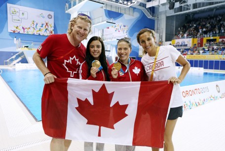 Harnett (far left) and Marcotte (far right) help celebrate the synchro diving gold won by Meaghan Benfeito (left centre) and Roseline Filion