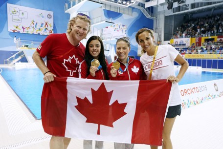 CB6P0816 Harnett (far left) and Marcotte (far right) help celebrate the synchro diving gold won by Meaghan Benfeito (left centre) and Roseline Filion
