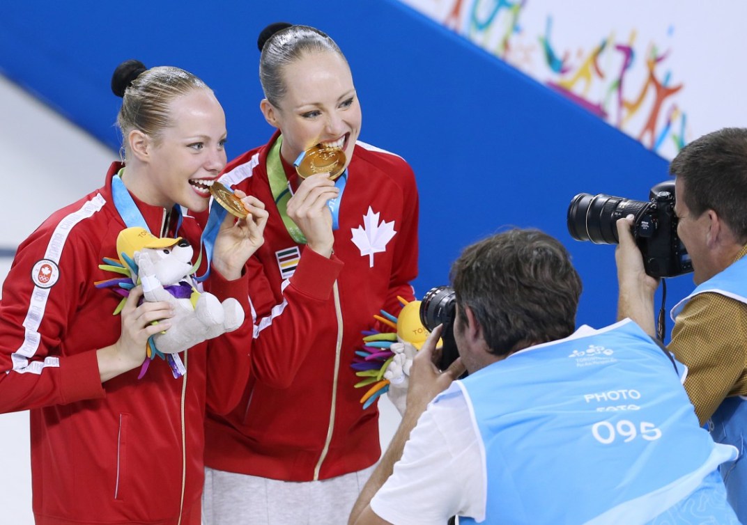 Karine Thomas and Jacqueline Simoneau of Canada compete in the Synchronized Swimming Duet Free Routine and win the Gold Medal. Photo by Vaughn Ridley.