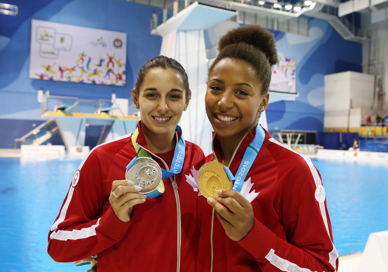 TORONTO, ON - JULY 12: Pamela Ware of Canada wins Silver and Jennifer Abel of Canada wins Gold in the Women's 3m Springboard Final during the Toronto 2015 Pan Am Games at the CIBC Aquatic Centre on July 12, 2015 in Toronto, Ontario, Canada. (Photo by Vaughn Ridley/Canada Diving)