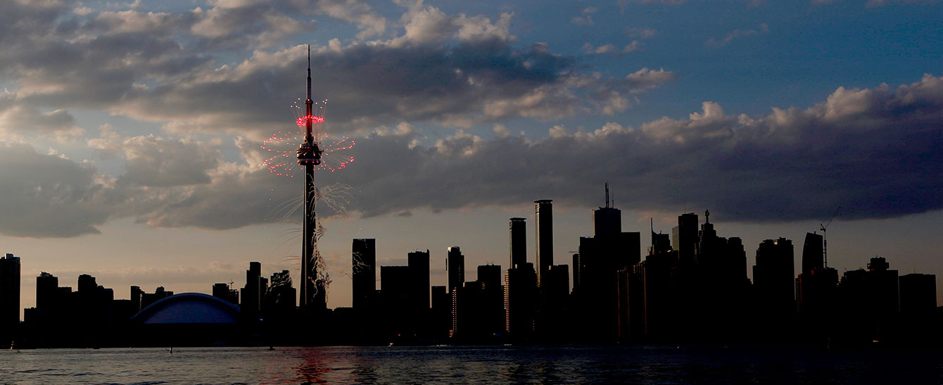 Fireworks sizzle around the CN Tower during the Opening Ceremony of the Toronto 2015 Pan American Games.
