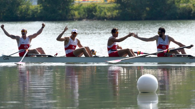 Conlin McCabe, Kai Langerfeld, Tim Schrijver and Will Crothers celebrate their Pan Am Games coxless four win on July 13, 2015