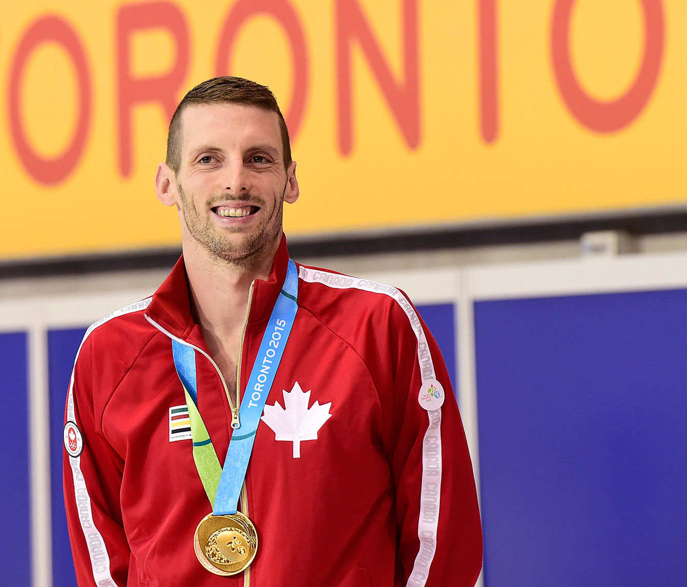 Ryan Cochrane smiles after receiving his Pan Am gold medal in the 400m freestyle, he also won the 1500m freestyle. 