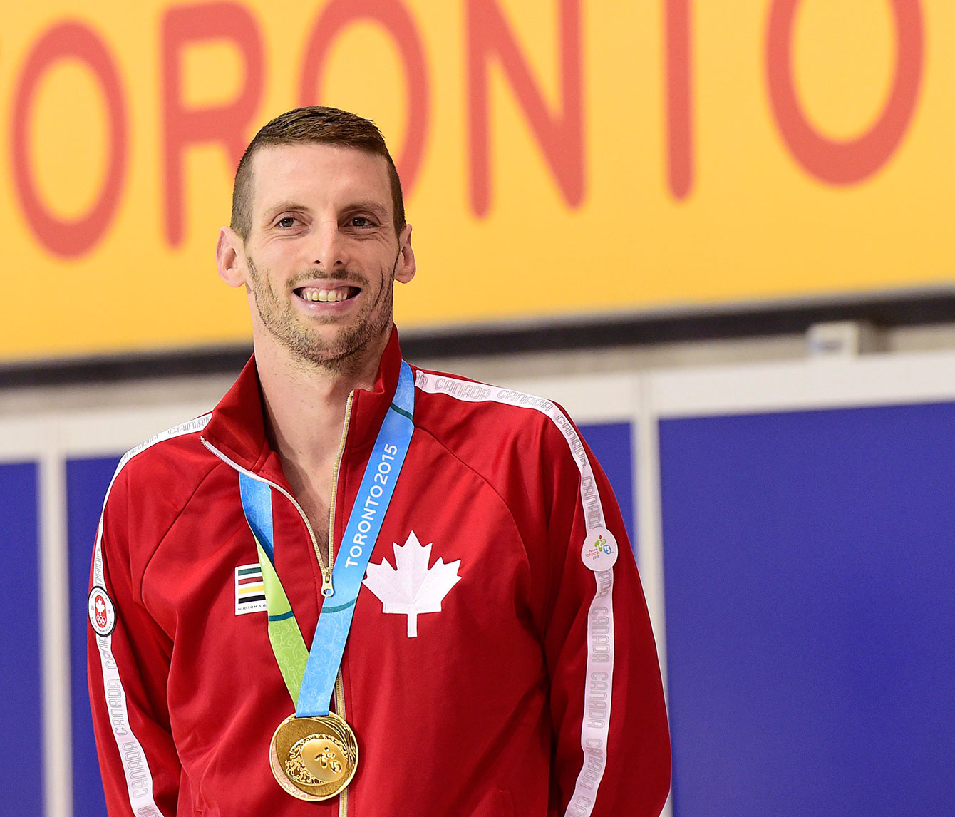 Ryan Cochrane smiles after receiving his Pan Am gold medal in the 400m freestyle, he also won the 1500m freestyle.