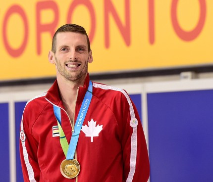 Ryan Cochrane smiles after receiving his Pan Am gold medal in the 400m freestyle, he also won the 1500m freestyle.