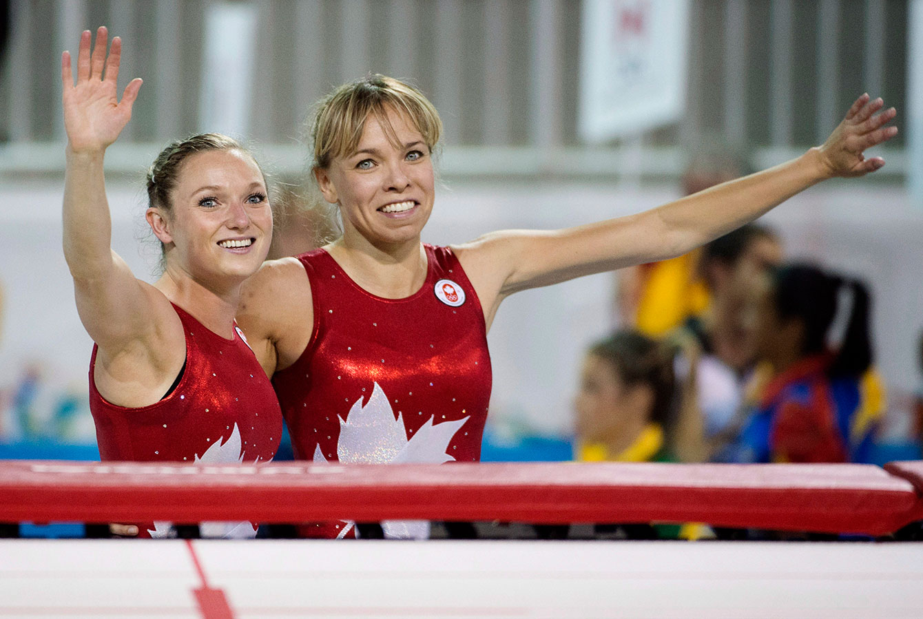 Rosie MacLennan (left) and Karen Cockburn celebrate their gold and bronze medals respectively during trampoline finals at the Pan Am Games.