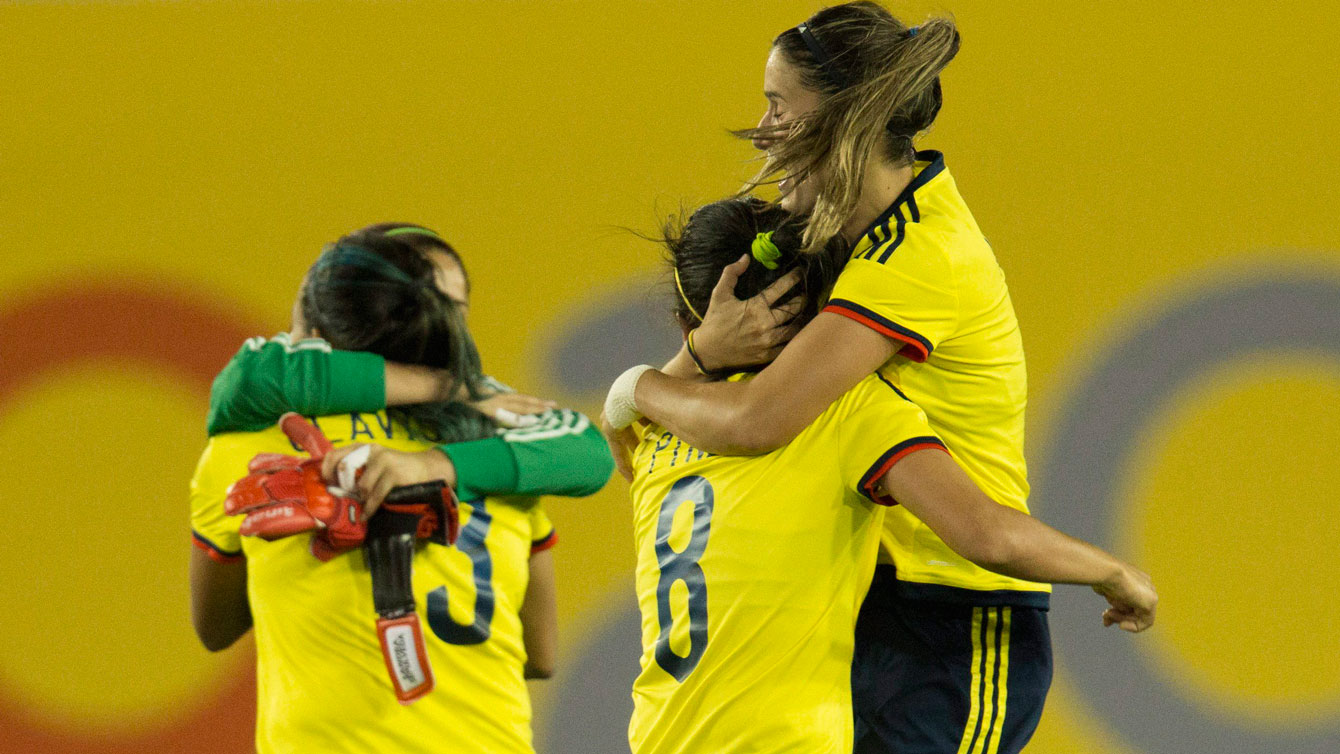 Colombia players celebrate scoring against Canada in semifinals of the Pan Am Games football tourney on July 22, 2015. 