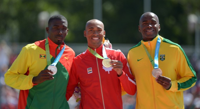 Damian Warner poses with his medal