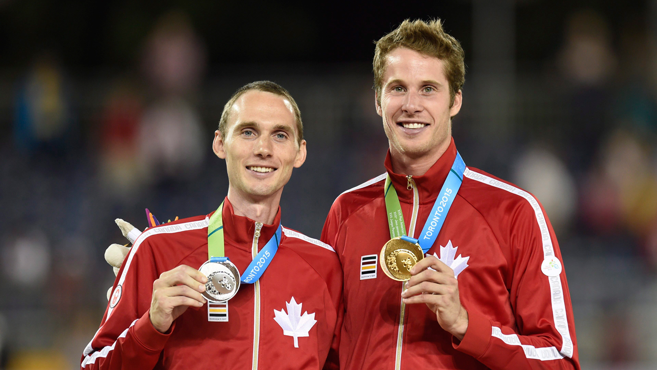 Derek Drouin (right) and  Mike Mason (left) celebrate after the men's high jump final at the 2015 Pan Am Games on  July 25, 2015. (THE CANADIAN PRESS/Frank Gunn)