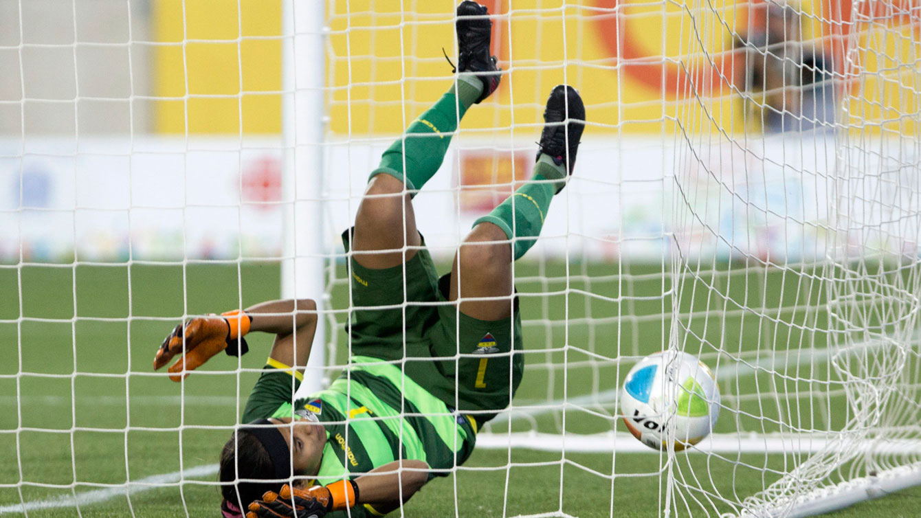 Ecuador keeper Shirly Berruz ends up inside her net after conceding during 5-2 loss to Canada in the Pan Am Games on July 11, 2015. 
