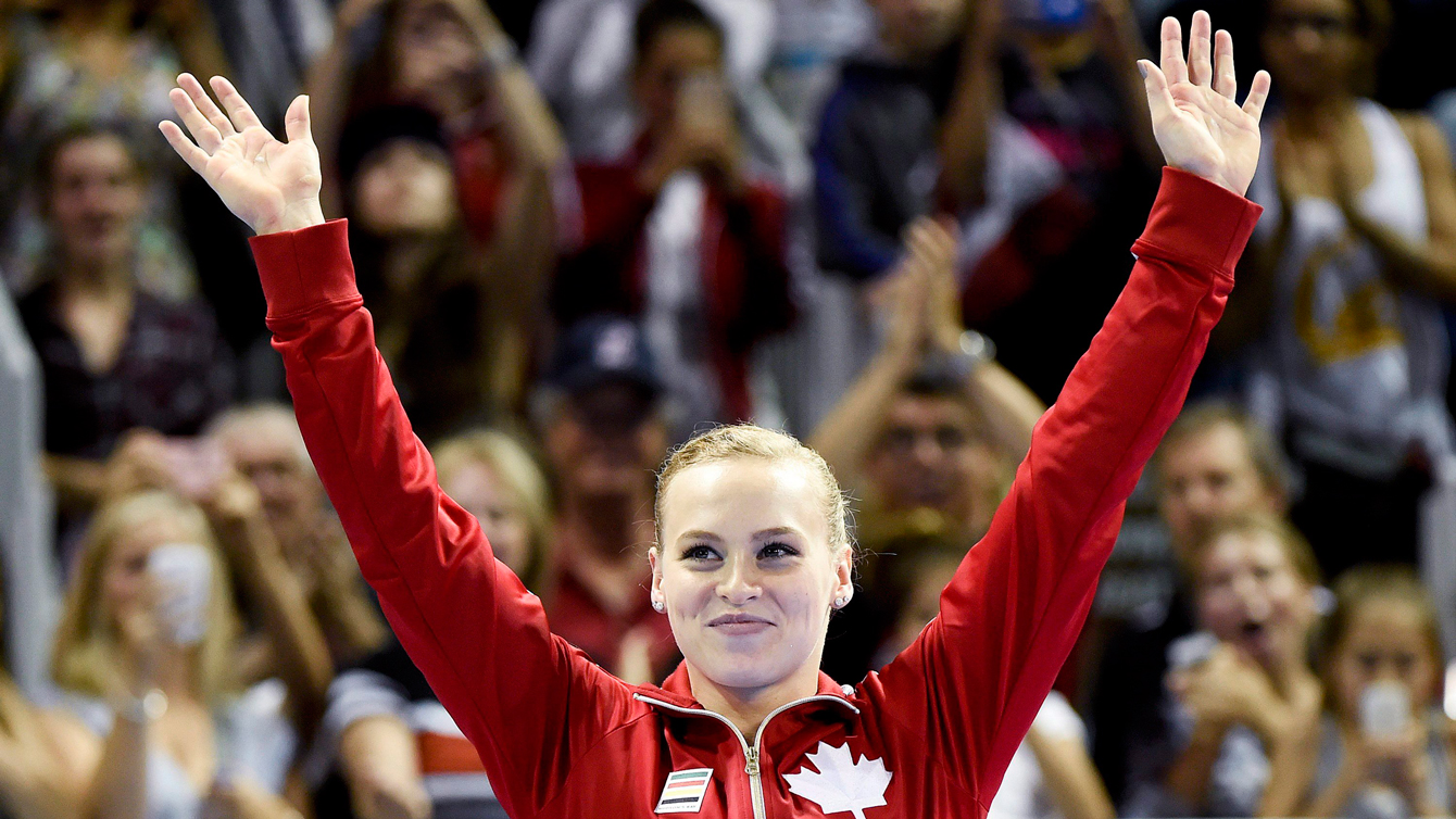Ellie Black waves to the crowd after winning the women's all-around at the Pan Am Games on July 13, 2015.