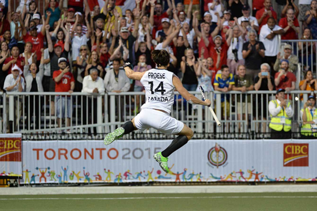 Adam Froese celebrates after scoring Canada's fifth shootout goal, securing a semifinal win. 