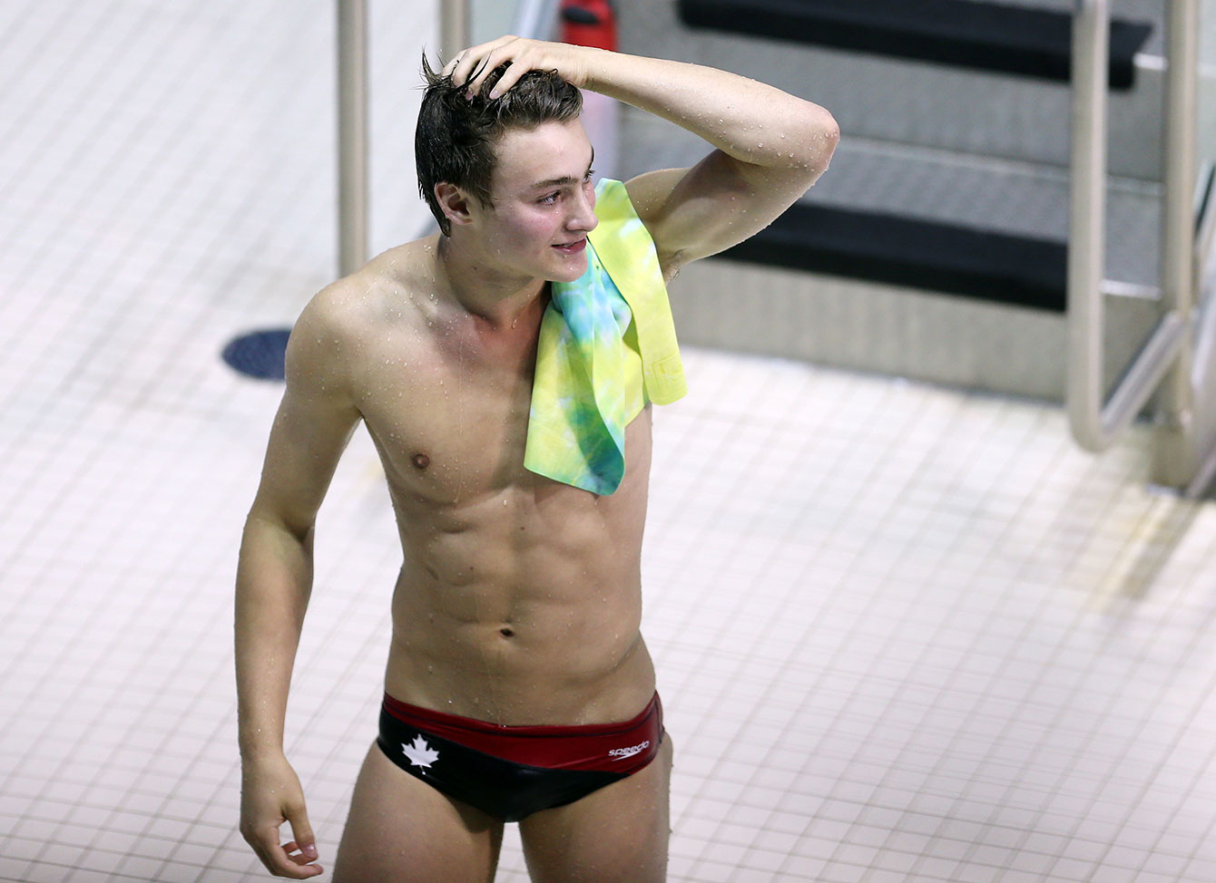 Philippe Gagné reacts to winning the bronze medal in the men's 3m springboard. 