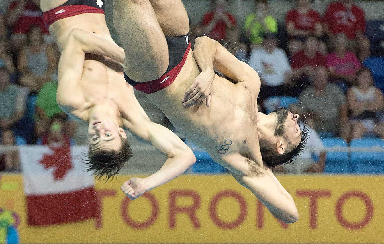 Philippe Gagné (left) and François Imbeau-Dulac compete in the men's 3m synchro at Pan Am Games. 